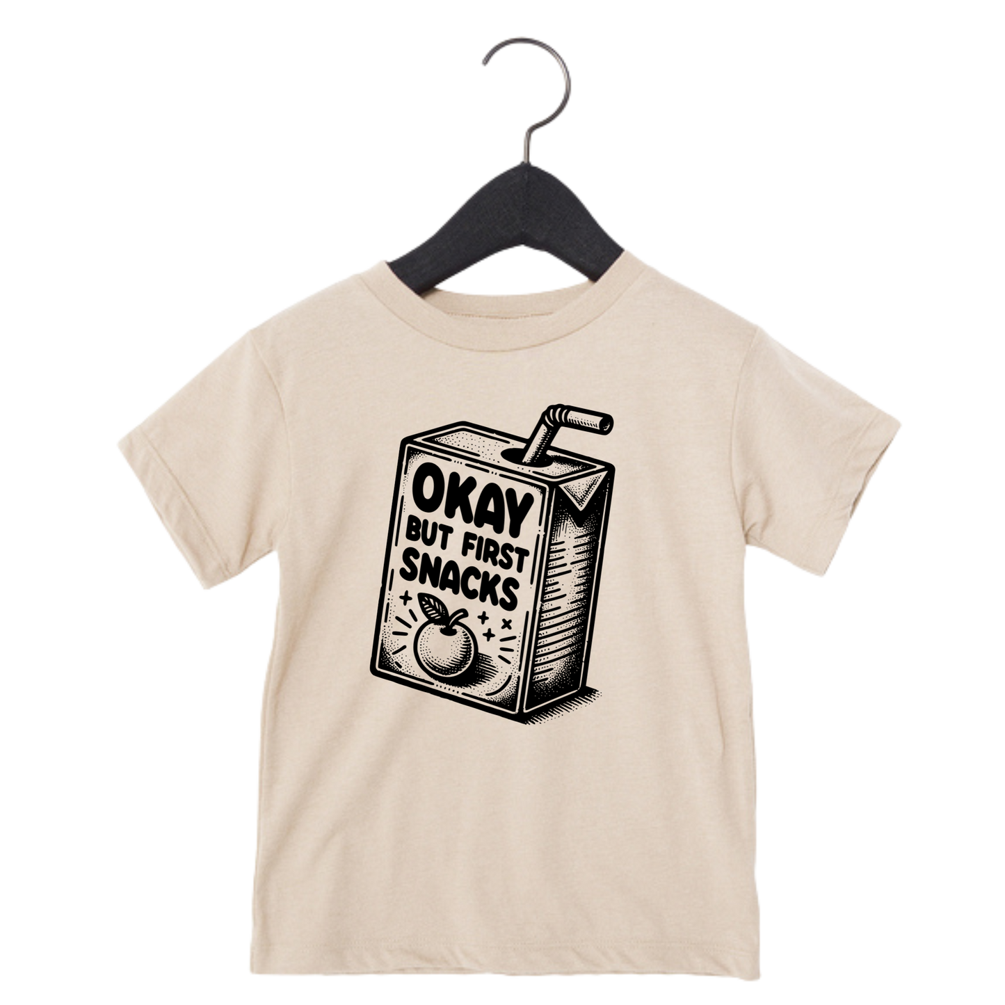 Toddler graphic tee with snack carton and the phrase ‘Okay But First Snacks’ – funny shirt for kids