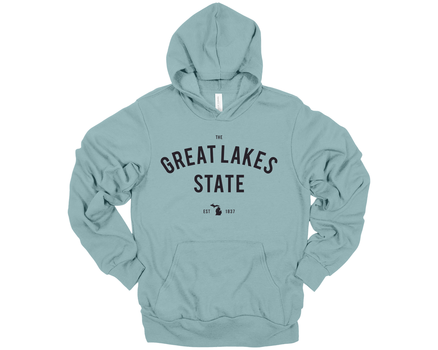 Cozy heather blue lagoon hoodie with Michigan pride design displayed in a modern, neutral-toned setting.