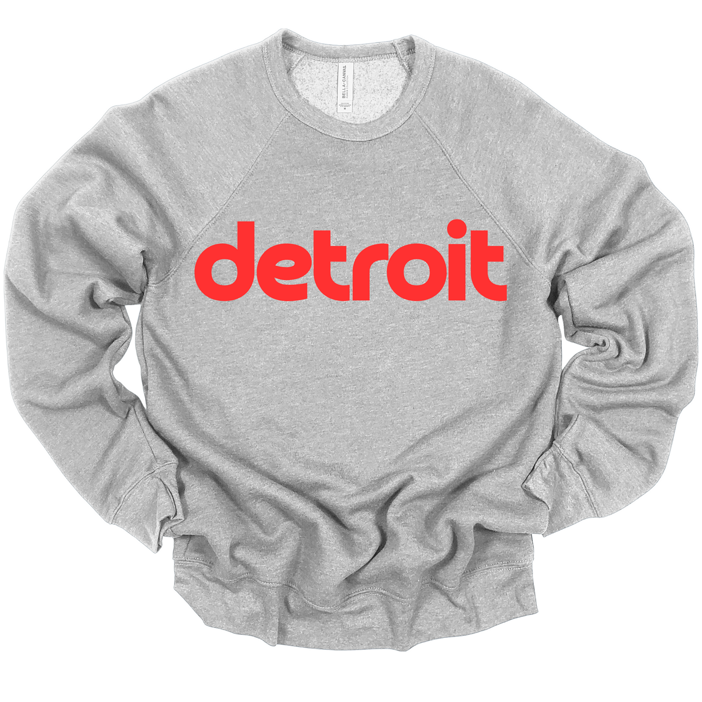 A heather gray hoodie featuring the word 'detroit' in bold, modern red lowercase lettering across the chest. The minimalist design gives a clean and stylish look, perfect for representing the Motor City in a simple yet bold way.