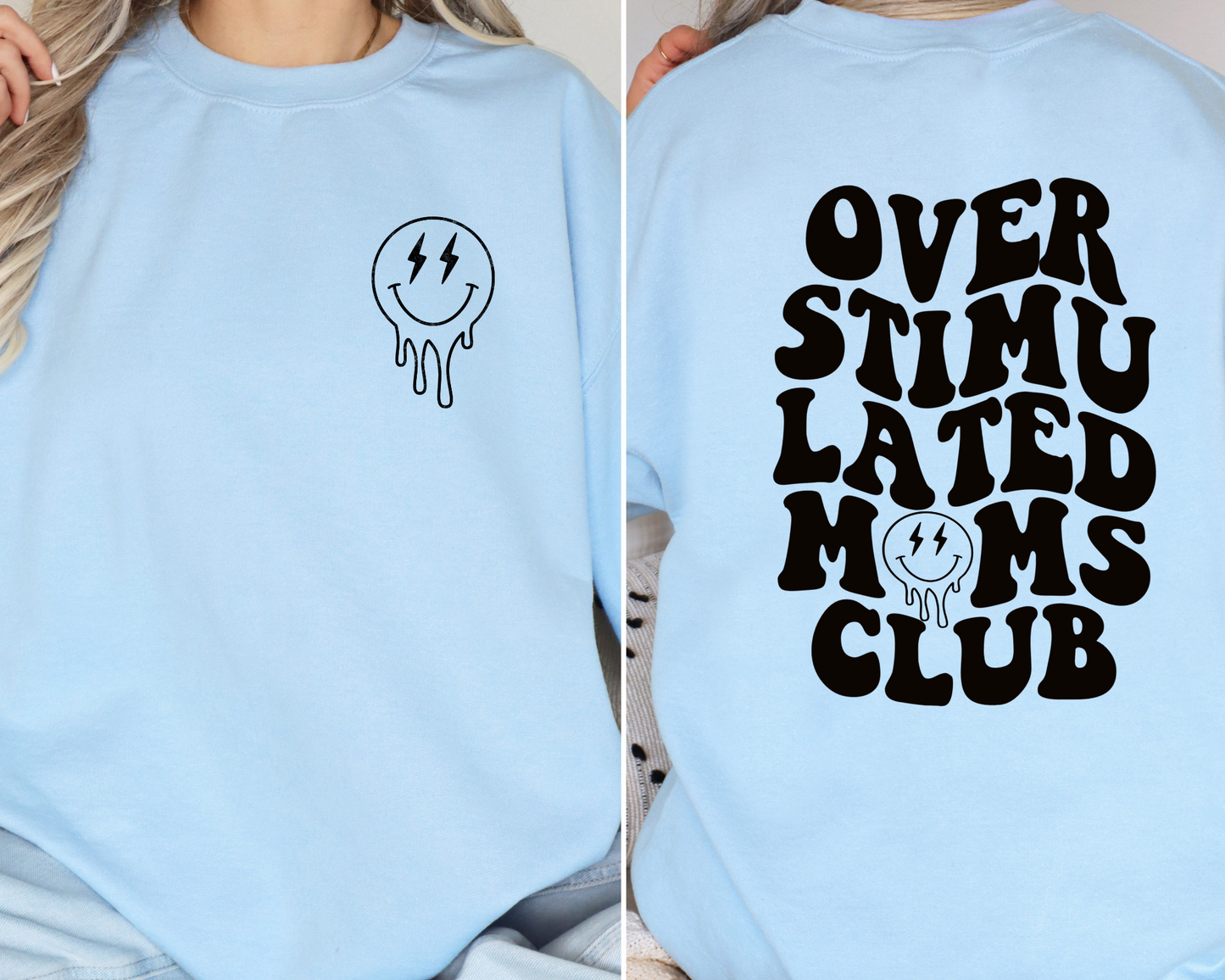 A light blue crewneck featuring bold, wavy black text that reads 'Overstimulated Moms Club' on the back. The design includes a melting smiley face with lightning bolt eyes, capturing the chaotic and exhausted yet humorous side of motherhood.