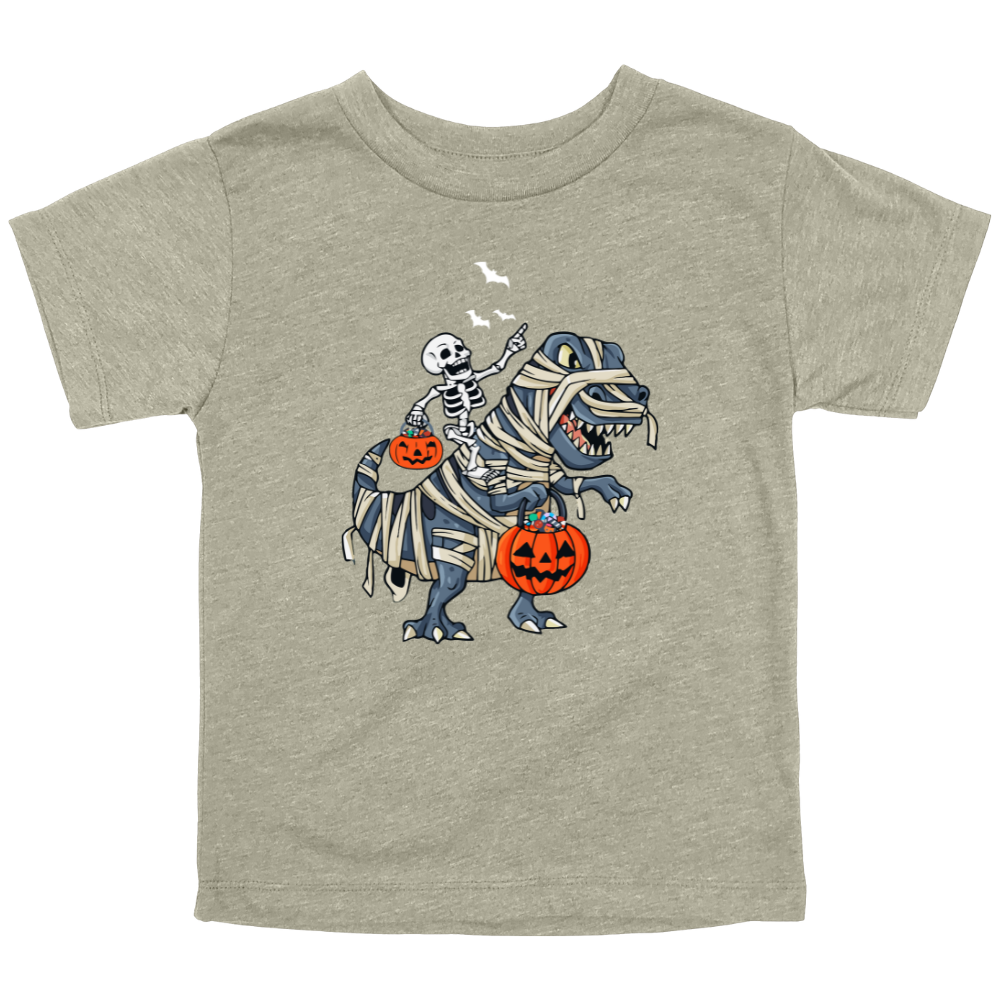 Cute Halloween graphic on stone colored toddler shirt with skeleton riding a mummy-wrapped T-Rex holding pumpkins