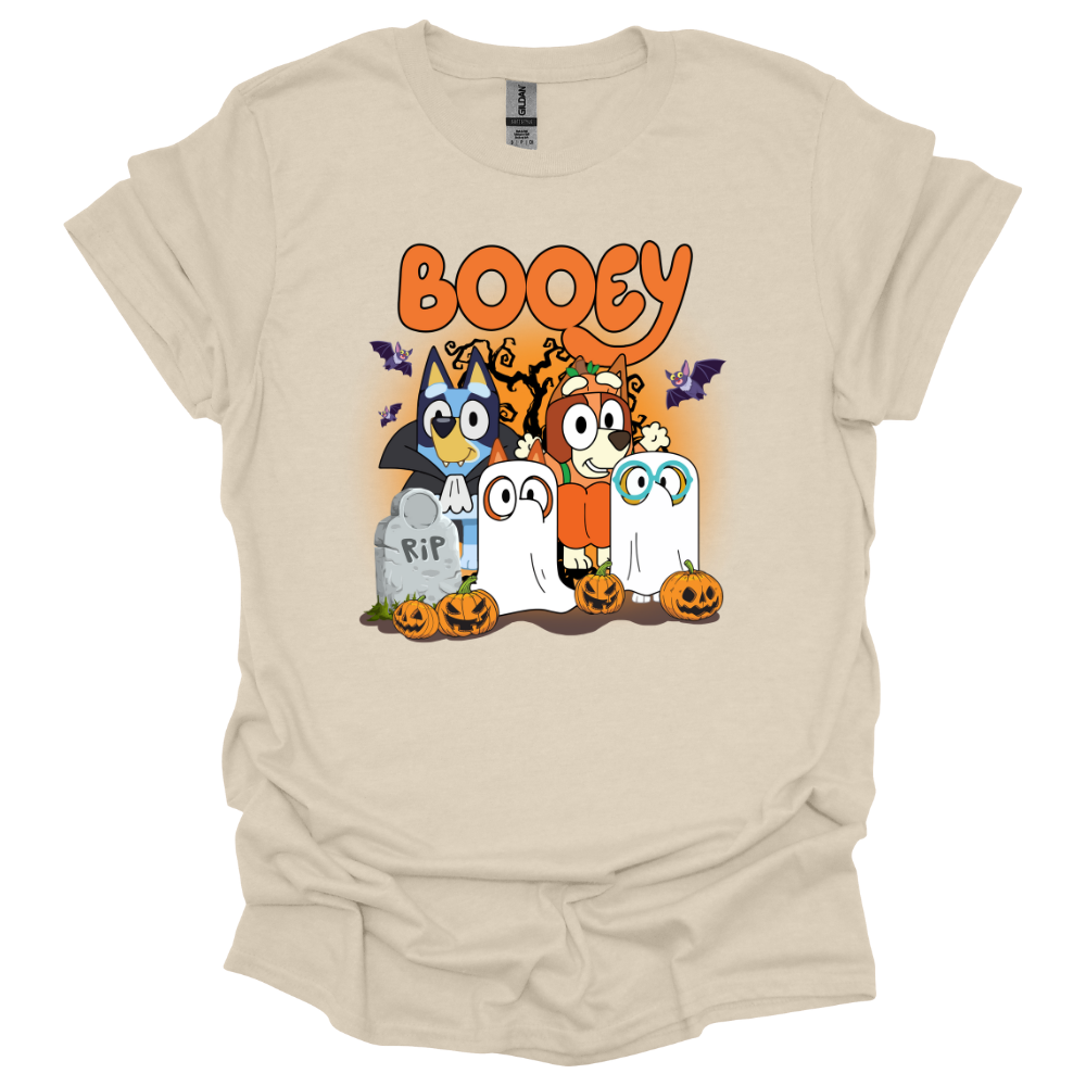 Natural colored youth t-shirt featuring Bluey-inspired characters in Halloween costumes with the word "Booey," tombstones, pumpkins, bats, and spooky trees.