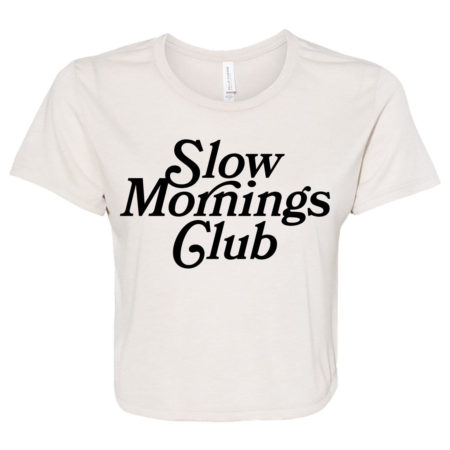 Heather Dust colored cropped t-shirt with bold black text “Slow Mornings Club”