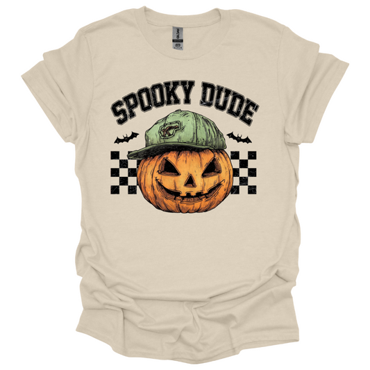 Natural color Youth Halloween shirt with “Spooky Dude” design featuring a pumpkin with a backwards cap and checkerboard background